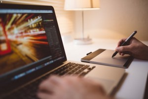 man's hand on laptop